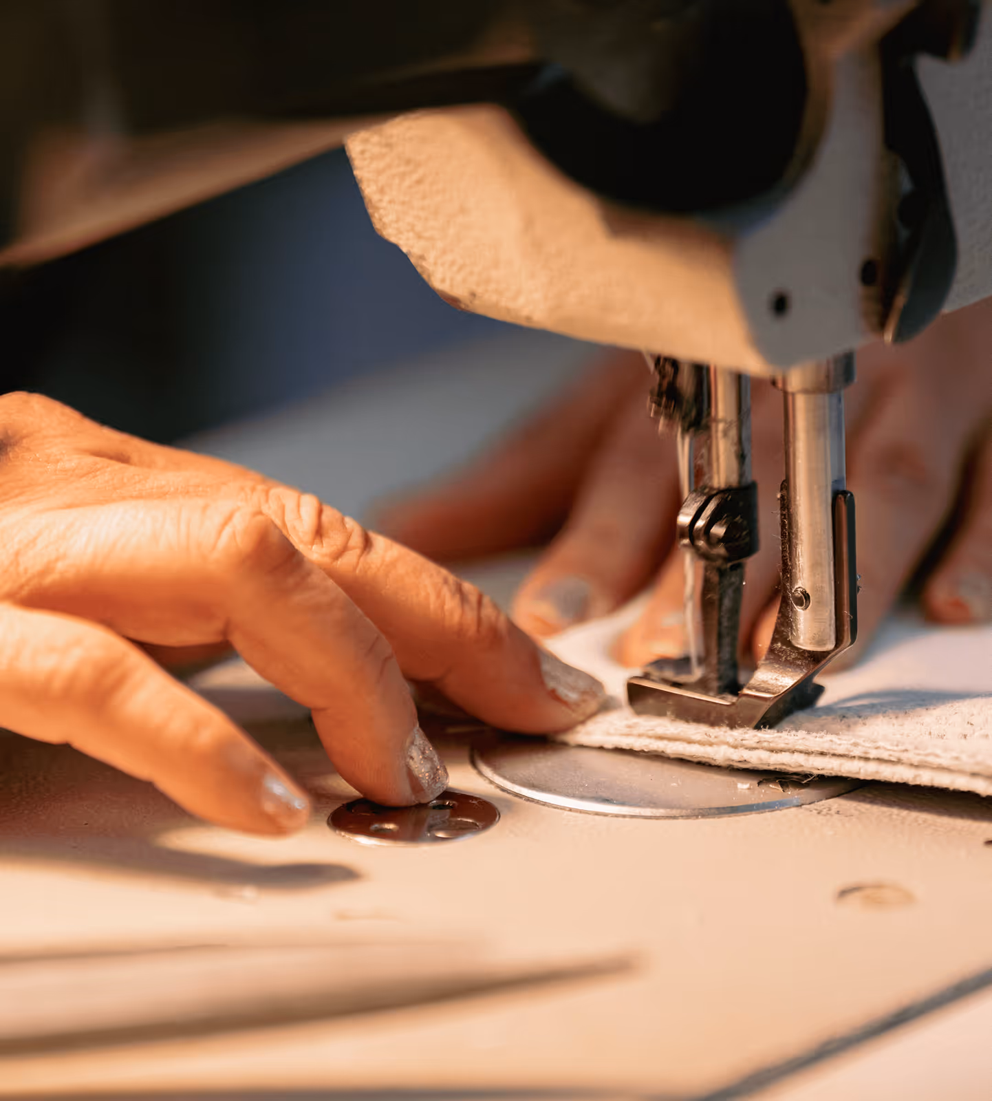 Craftsman sewing upholstery seam